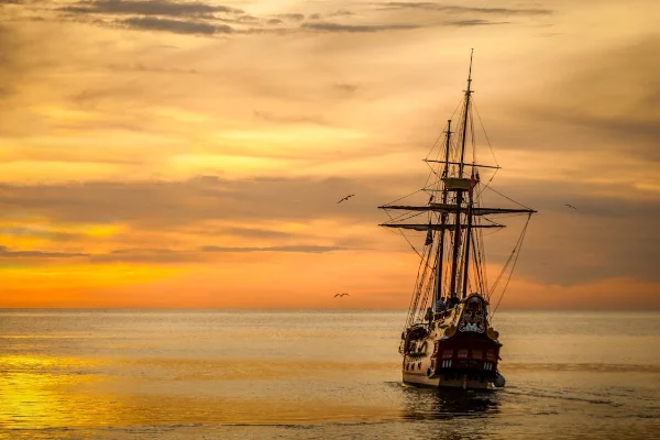 Historical Ship in the sunset, with sepia overtones.